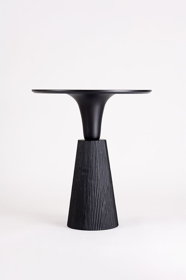 Blackened wood pedestal table with fluted conical base