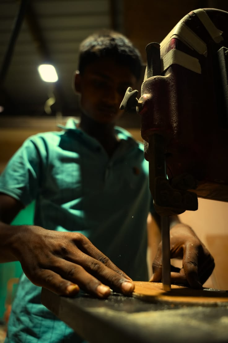 MM Decor craftsman cutting a wooden component on a bandsaw in Moradabad